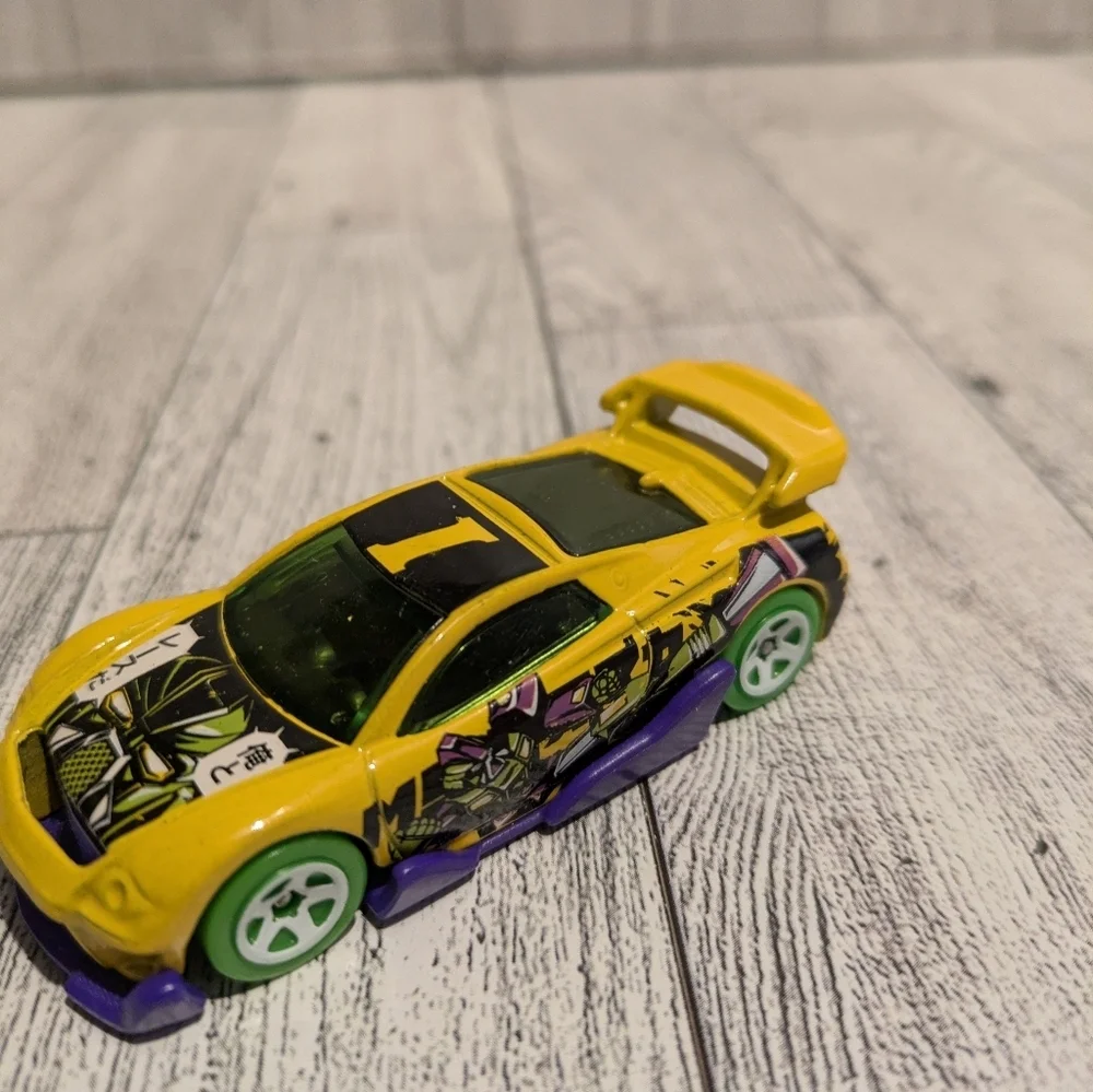 hot Wheels Yellow Graphic Racing Toy Car with Green Wheels